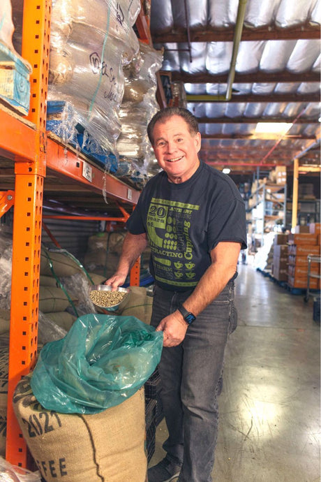Mike scooping green coffee