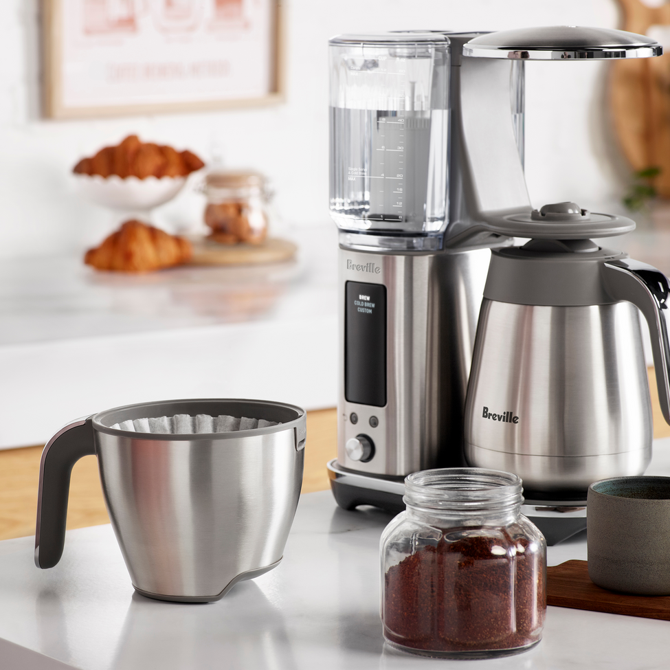 Breville coffee maker with accessories on a kitchen counter
