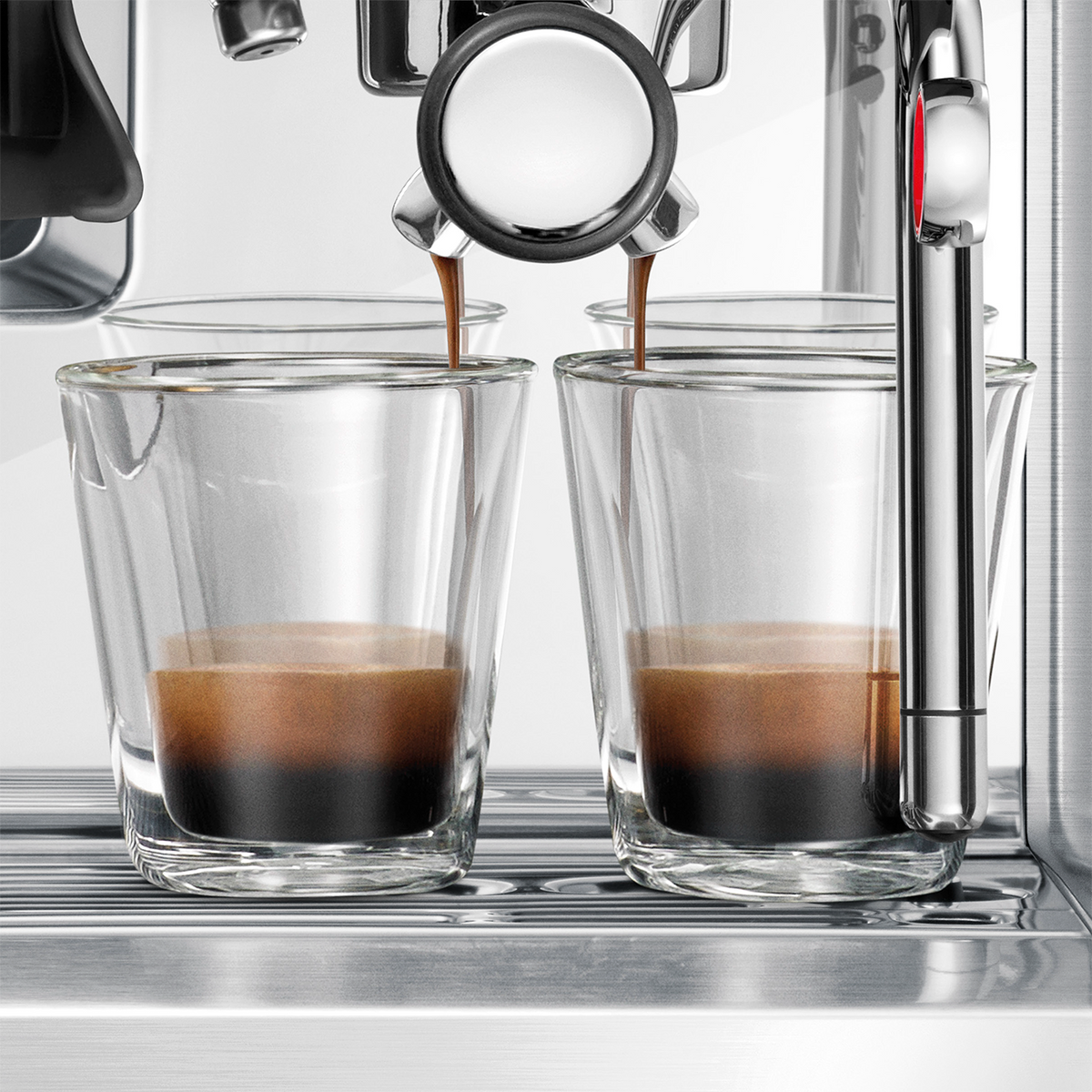 Espresso being poured into two glass glasses from a Barista Touch Espresso Machine.
