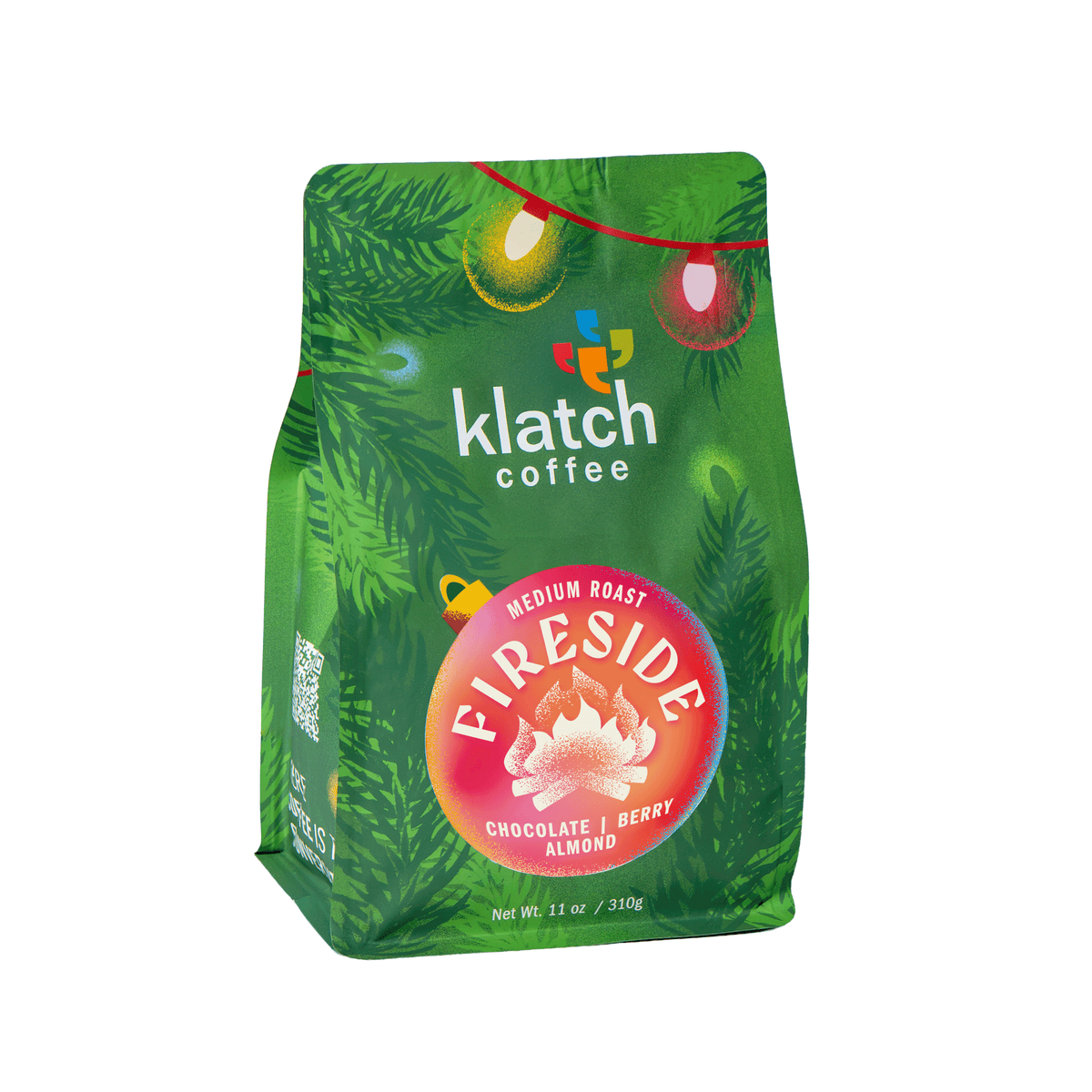Klatch Coffee Fireside holiday coffee in festive green packaging with colorful Christmas lights on a white background.