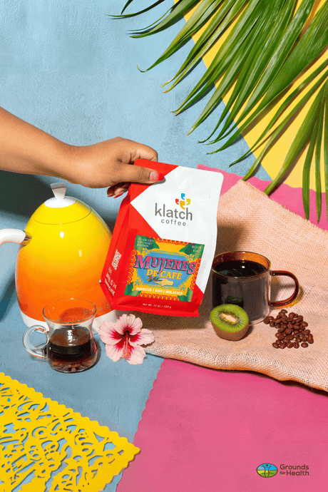 Klatch Coffee Mujeres De Cafe with a colorful background featuring coffee and decorative elements.