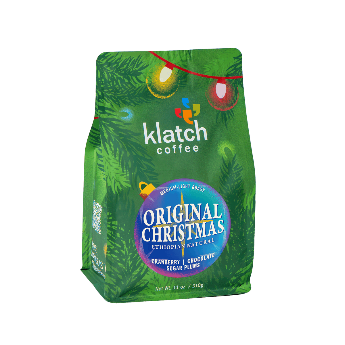 Klatch Coffee Original Christmas holiday coffee in festive green packaging with colorful Christmas lights on a white background.