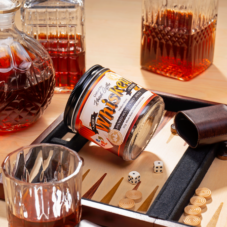 Aged Whiskey Reserve set on a backgammon, dice, dice cups, crystal whiskey decanters and a glass of Whiskey Coffee.