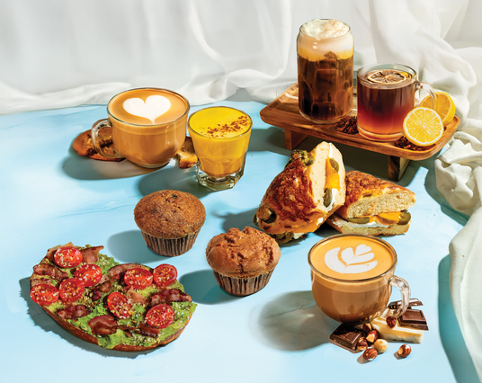 Good for the Body & Soul Menu: Assorted seasonal drinks, items including pastries, and a sandwich on a light blue surface.