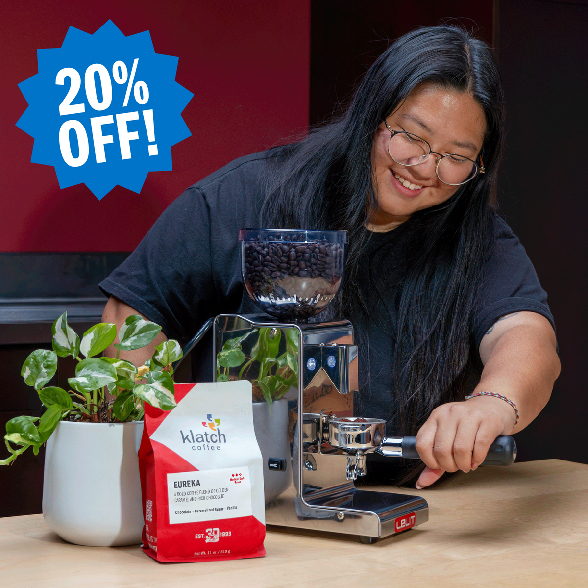 Woman using a LELIT grinder alongside a bag of Klatch Coffee Eureka Espresso, with a badge highlighting 20% off.