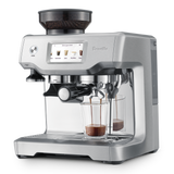 Barista Touch Espresso Machine with shot glass of espresso.