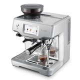 Barista Touch Espresso Machine with shot glass of espresso top 3/4 view