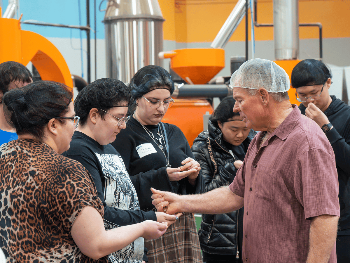 Klatch Coffee training session with a Mike Perry guiding a group through a hands-on lesson inside the roasting facility.