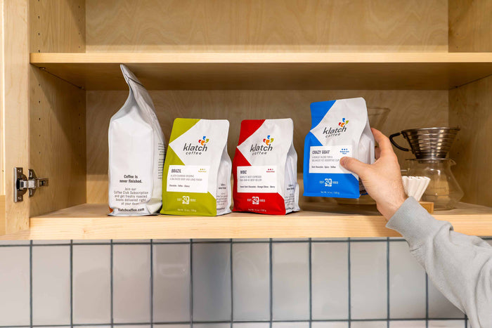 a selection of Klatch Coffee bags on a shelf