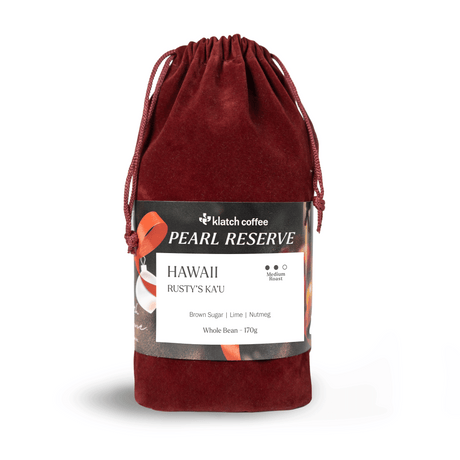 Red velvet drawstring bag of Hawaii with white background.