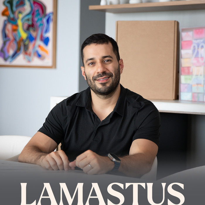Wilford Jr. producer sitting at a desk with 'LAMASTUS' branding in the foreground