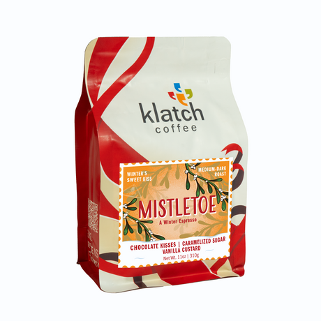 Holiday red and white Klatch Coffee Mistletoe package on a white background