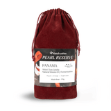 Red velvet drawstring bag with a label for klatch coffee Pearl Reserve Panama on a white background