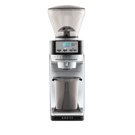 Front view of a Baratza espresso grinder with a dark gray and silver body, a clear bean hopper on top, and a clear collection cup below, shown on a solid white background.