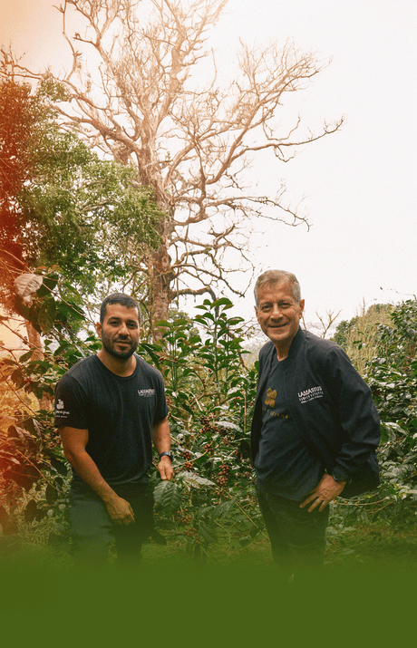 Lamastus Family Estate with Wilfor Sr. and Jr in front of coffee trees.