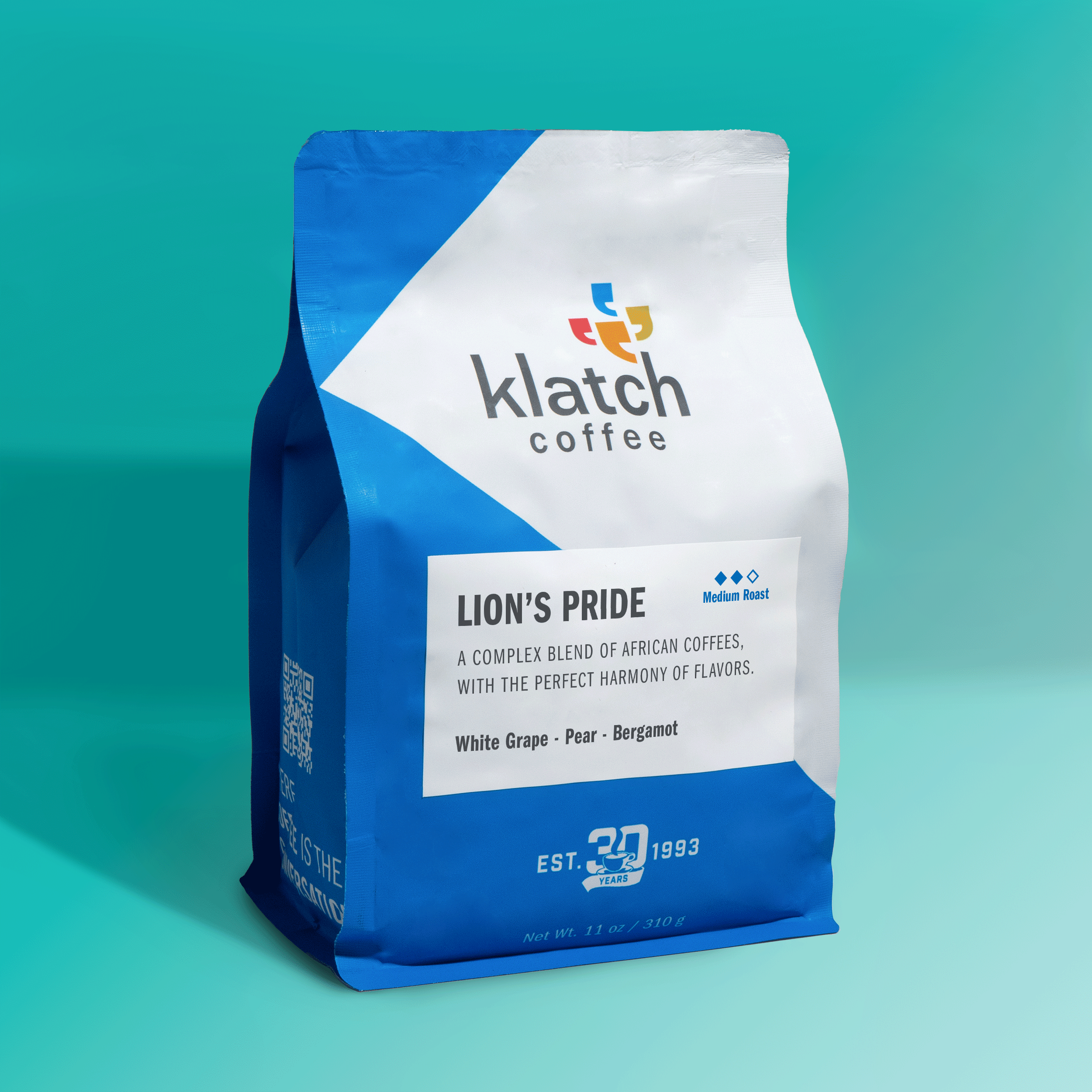 Bag of Klatch Coffee Lion's Pride blend displayed on a turquoise background, showcasing the coffee packaging and blend name.