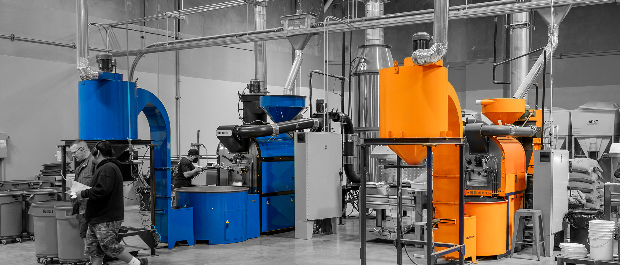 Factory interior with large orange and blue machinery